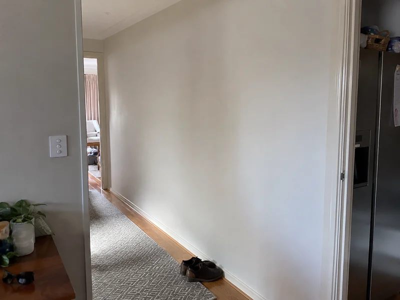 Repaired and repainted hallway wall