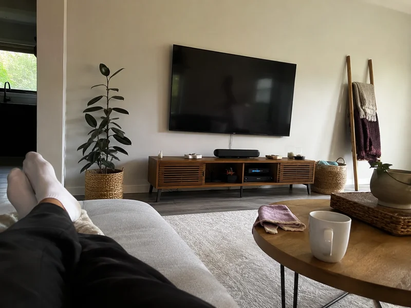 Wall-mounted television installed level with tidy cabling